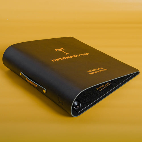 Luxury black leather binder for classic car service history records with gold foil personalisation of car chassis number and De Tomaso Pantera logo 