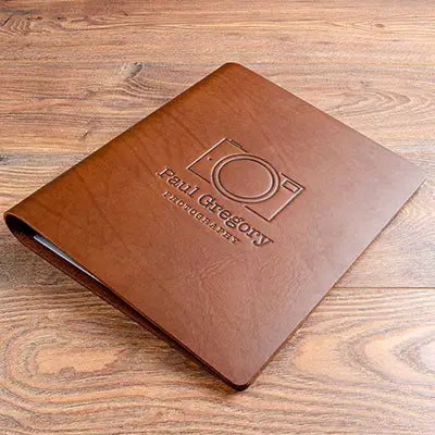 Personalised A4 leather photographers portfolio book with embossed logo on the cover. hand made by Hartnack and Co