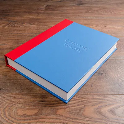 blue and red custom made clamshell box personalised with blind embossed cover used for photography presentation portfolio 