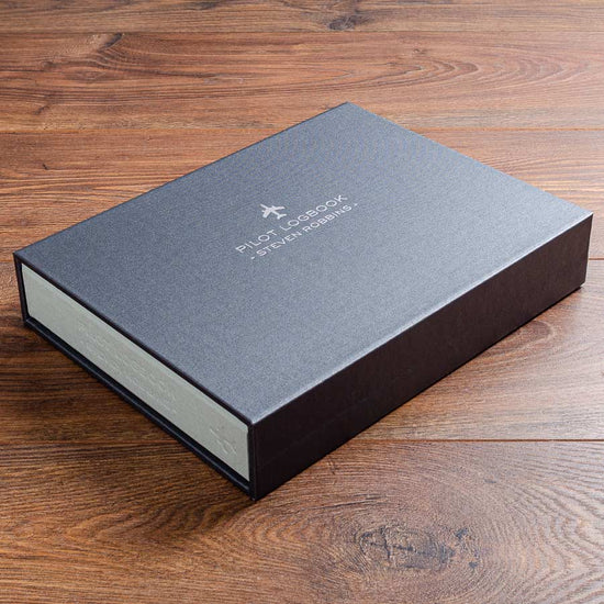8.5x11 personalised pilot log book and slipcase in grey buckram with silver foil embossed cover