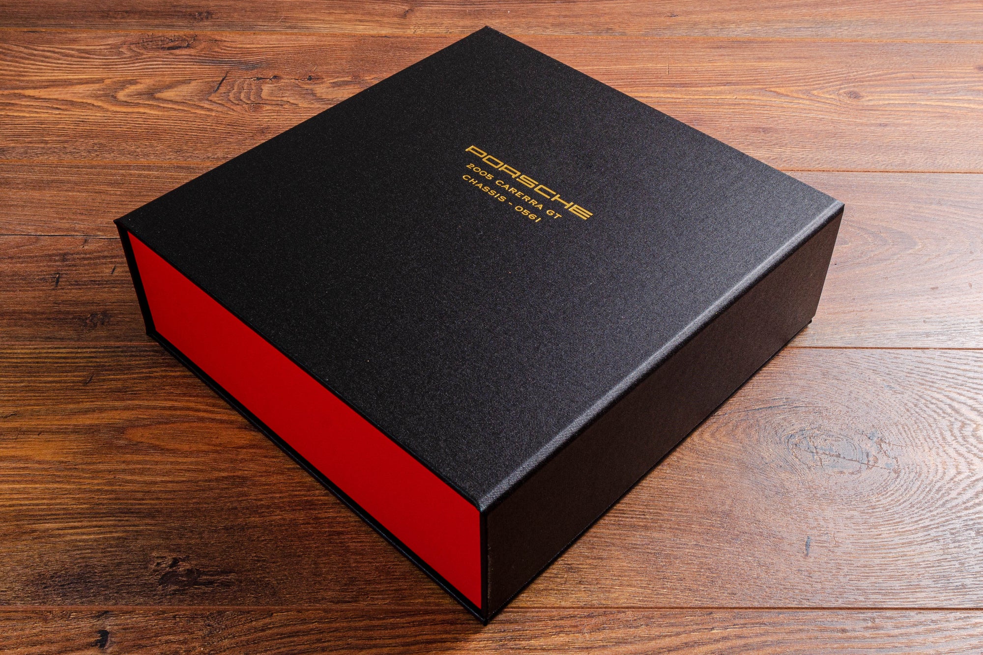 Bespoke clamshell box binder for Porsche vehicle documents