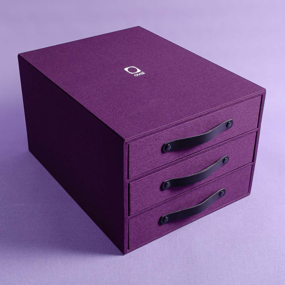 presentation box with drawers in purple book cloth with black handles and a white embossed logo on the top - Gallery image 1