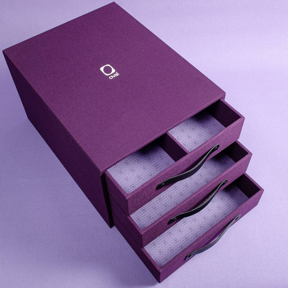 presentation box in purple with three drawers custom printed lining and personalised with a white logo foiled on the cover  - Business, Multi Slipcase