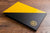 Portfolio book for graphic designer. Size is 11x17 inches. Product is hidden screw post binder. Colour is black and yellow buckram. Personalisation in fill colour UV printing