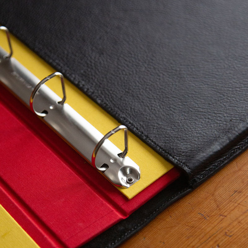 Custom made ring binder sitting in luxury black leather binder holder - Gallery image 4
