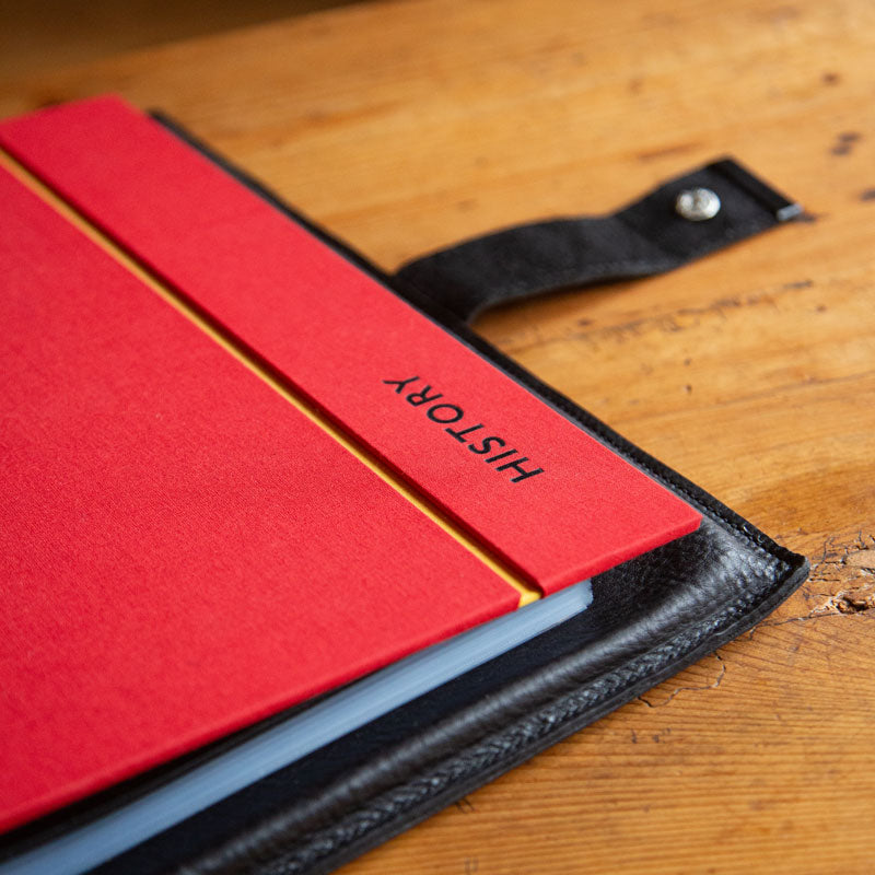 Custom made luxury ring binder in red with the words 