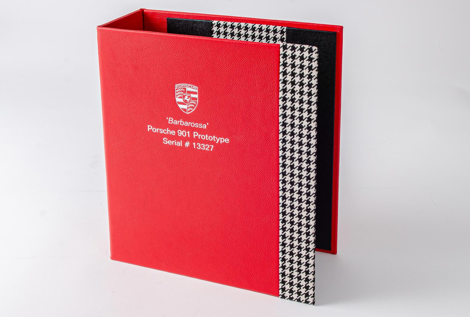 car document history file custom made in red leather with fabric hounds tooth detail and silver foil embossing on the cover