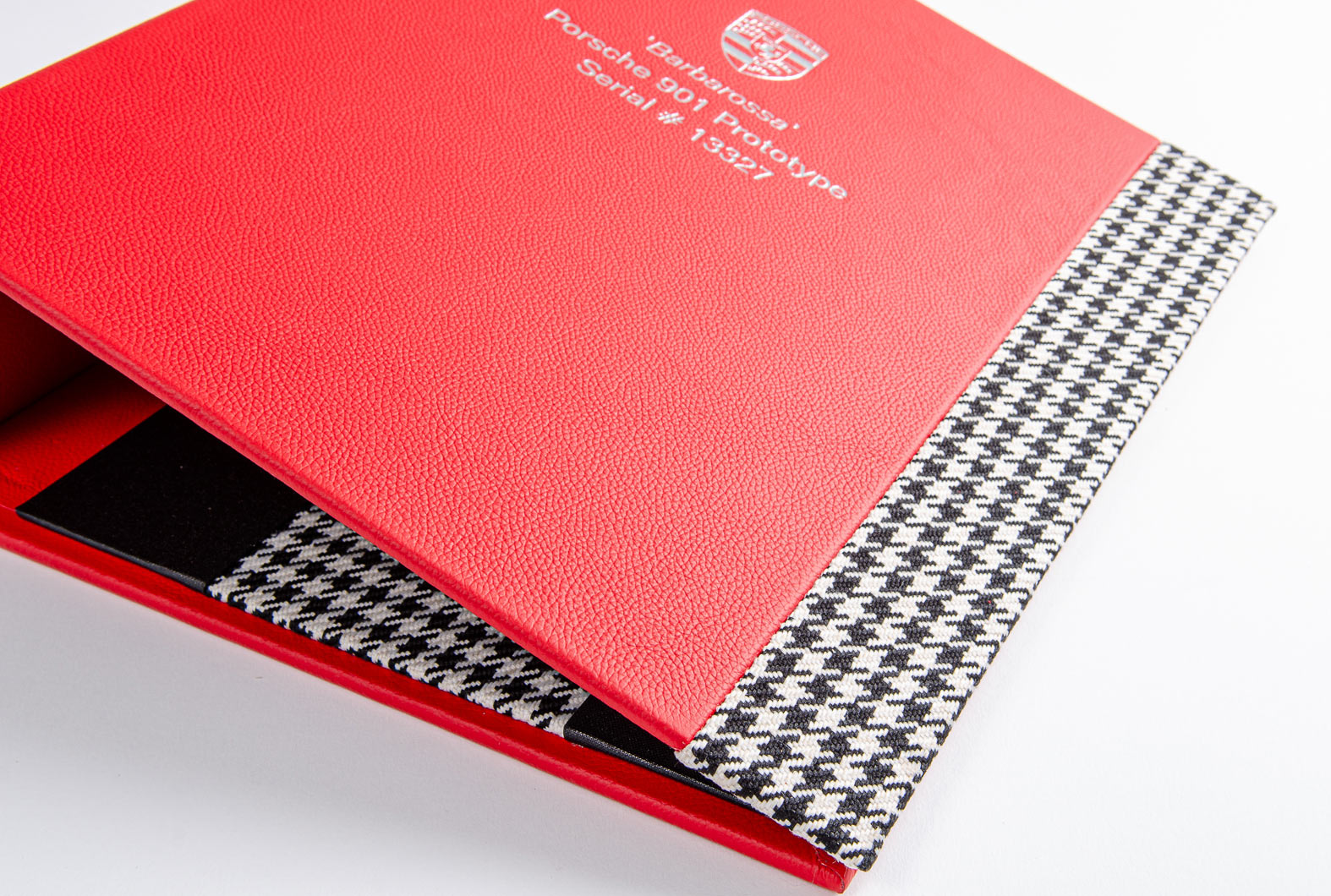 luxury red leather ring binder for historic car documents with fabric seat cover detail and personalised cover