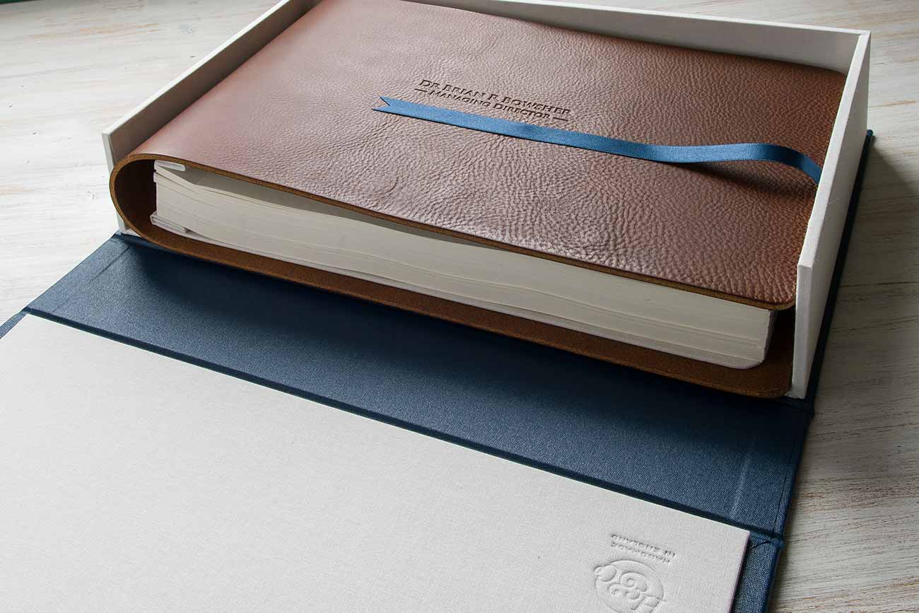 Leather-bound presentation folder within personalised clamshell box