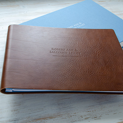 large brown leather personalised wedding album and blue box