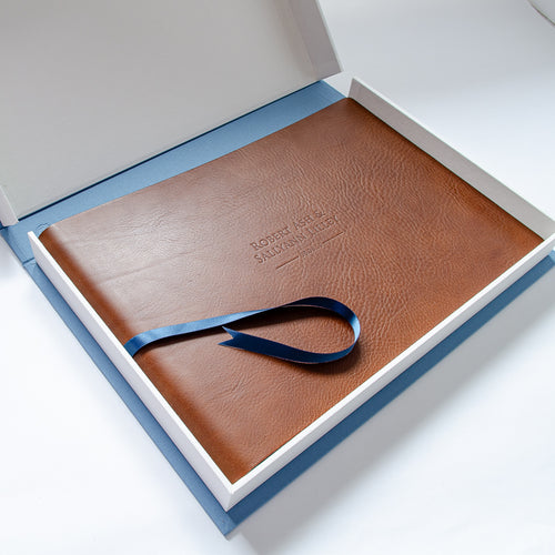 brown leather personalised embossed album in luxury white and blue clamshell box