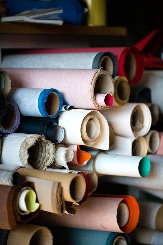 rolls of book cloth piled up in hartnack and co studio