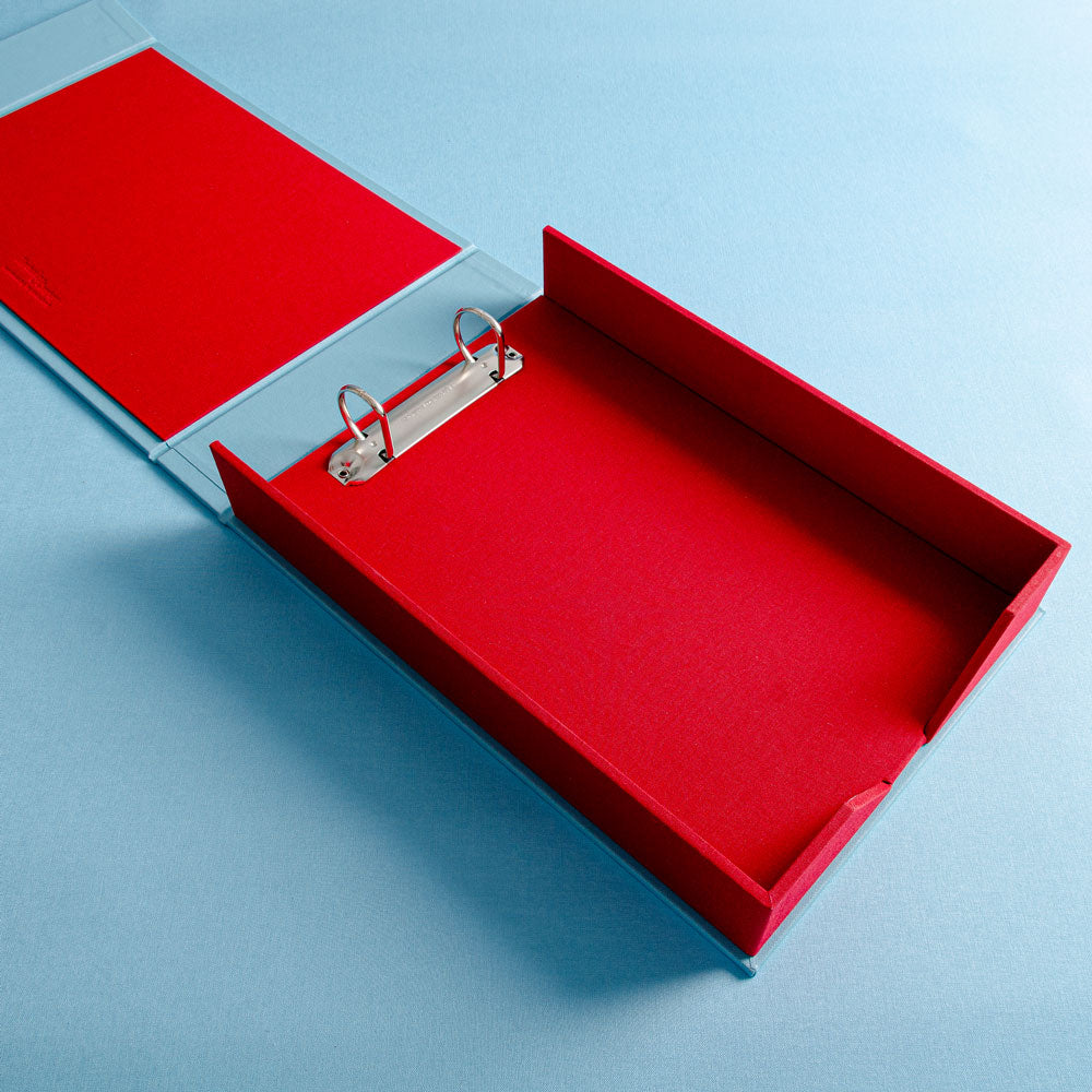 red two ring clamshell box file on a blue background - Gallery image 1