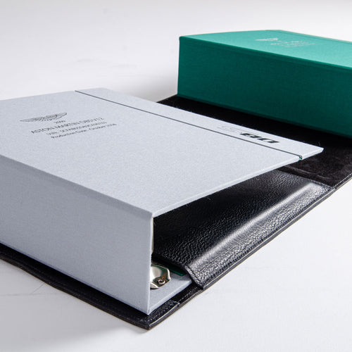 Detail of custom made luxury ring binders with personalised covers sitting within a hand stitched leather binder cover by Hartnack & Co.