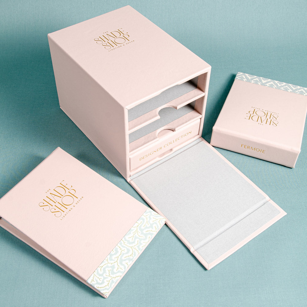 custom made leather slip case box with flap and personalised gold foil logo, together with three fabric swatch book personalised on the cover with foil emboss and fabric flash - Business