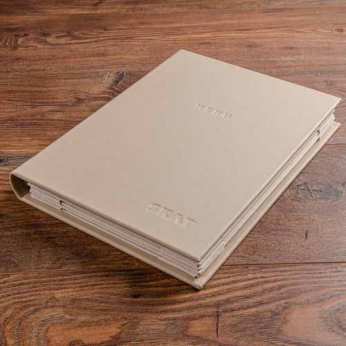 Genuine leather menu cover holding 8 pages with blind embossed logo on the cover