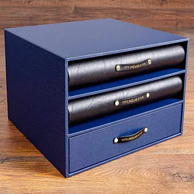 Slipcase box with black leather binders for Jaguar E type documents and history files