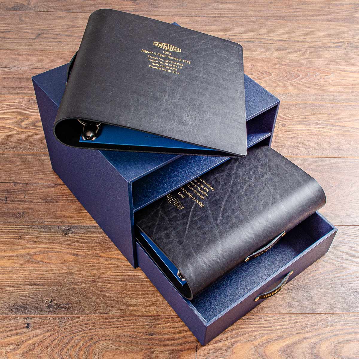 Black leather binders for vehicle documents and history in custom made case - Gallery image 1