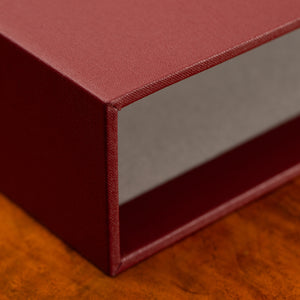 Luxury lined slipcase for book or portfolio binder covered in hard wearing cloth or leather