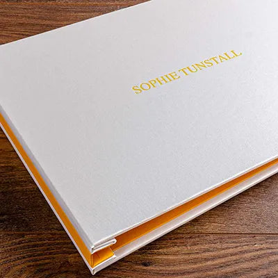 A3 photography portfolio book screw post binder in white and yellow buckram with yellow foil personalisation embossed on the cover