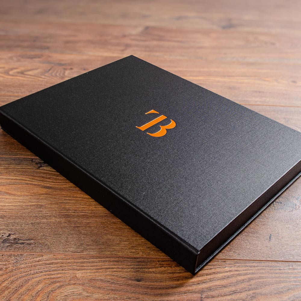 black photographers print portfolio box with copper foil logo stamped into the cover. - Gallery image 1
