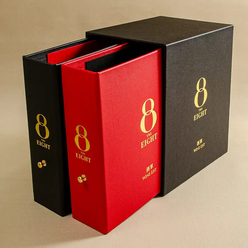 Luxury red and a black genuine leather ring binder set with gold foil personalisation and a black leather slipcase box also gold embossed. The binders sit just outside the box. This set will be used as Wine List for a Michelin Star luxury restaurant.