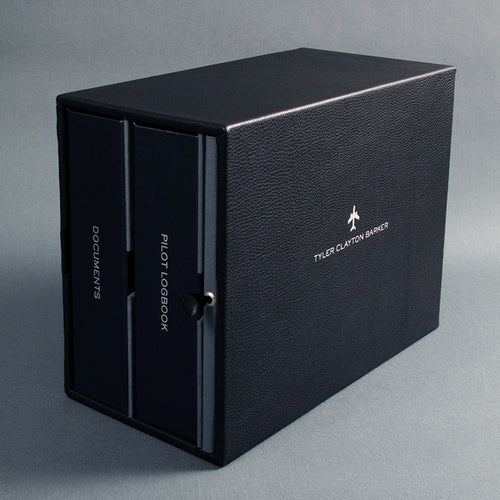 large black leather slipcase with silver embossed personalisation holding pilot logbook and pilot document binders