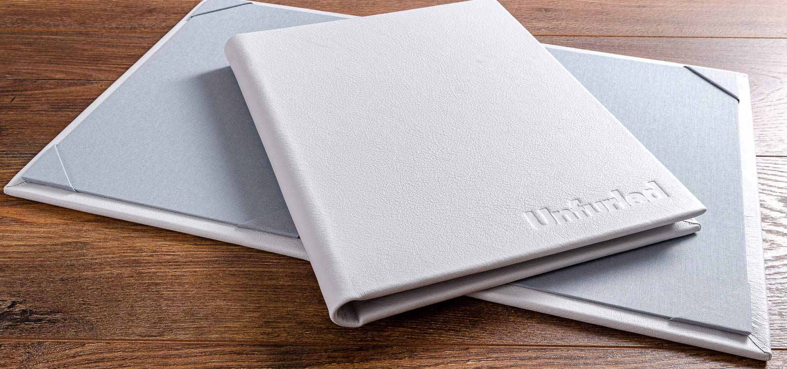 custom made menus in white leather with personalised embossing for luxury yacht