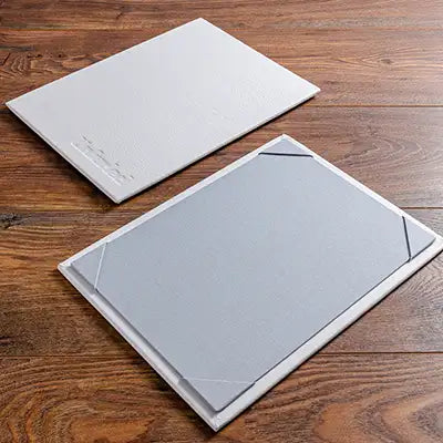 single page menu board bound in genuine white leather and personalised with blind embossed logo 
