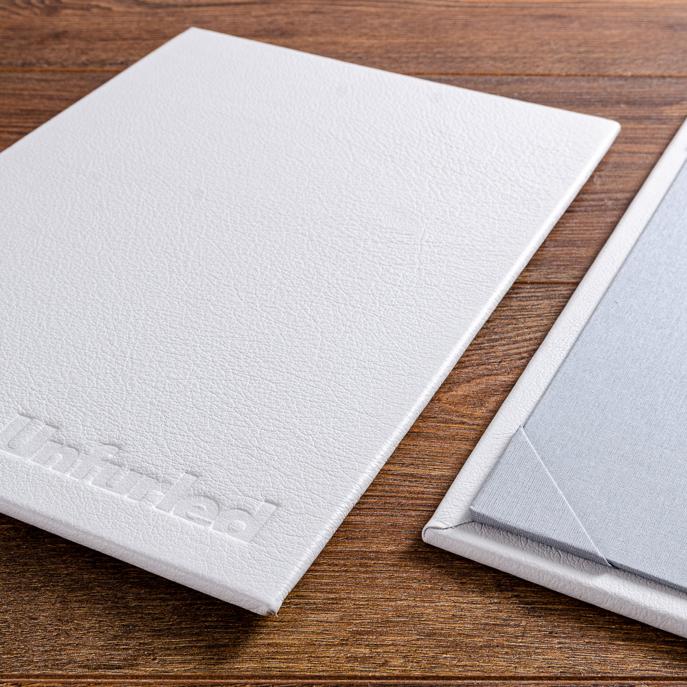 Blind embossed personalised leather menus with corner page retainers - Gallery image 1