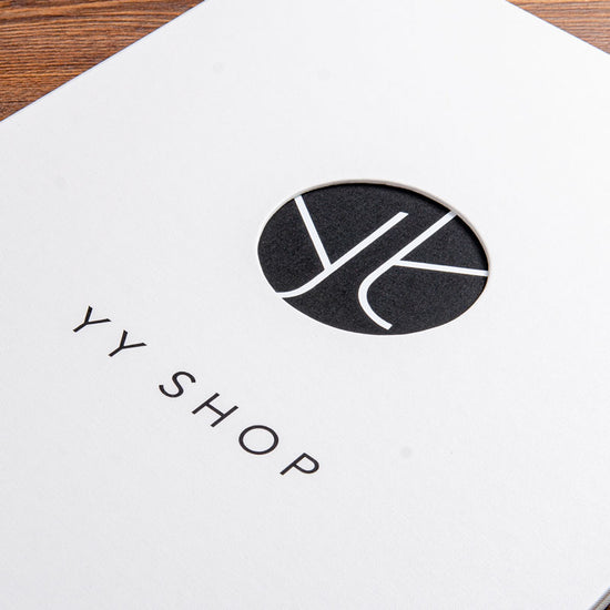 cut in the cover of luxury binder with a white foil logo and black embossed lettering on the cover