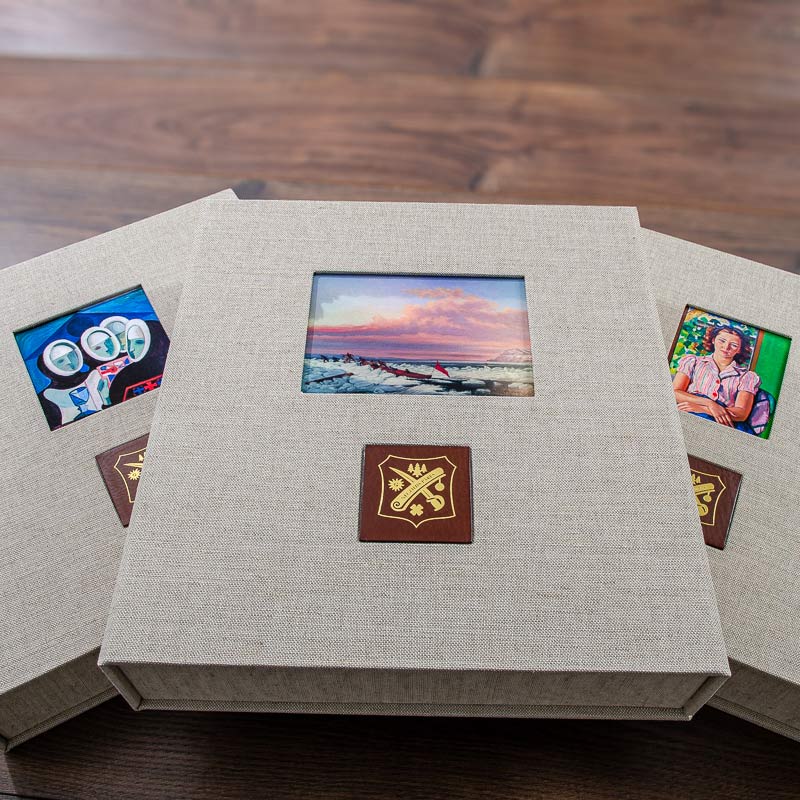 custom made luxury clamshell presentation boxes personalised with pictures inset into the cover and gold embossed logos  - Gallery image 1