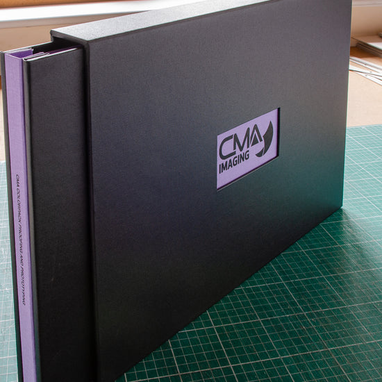 Custom made 11x17 portfolio book with window in the cover and personalised emboss logo and embossed title on the spine