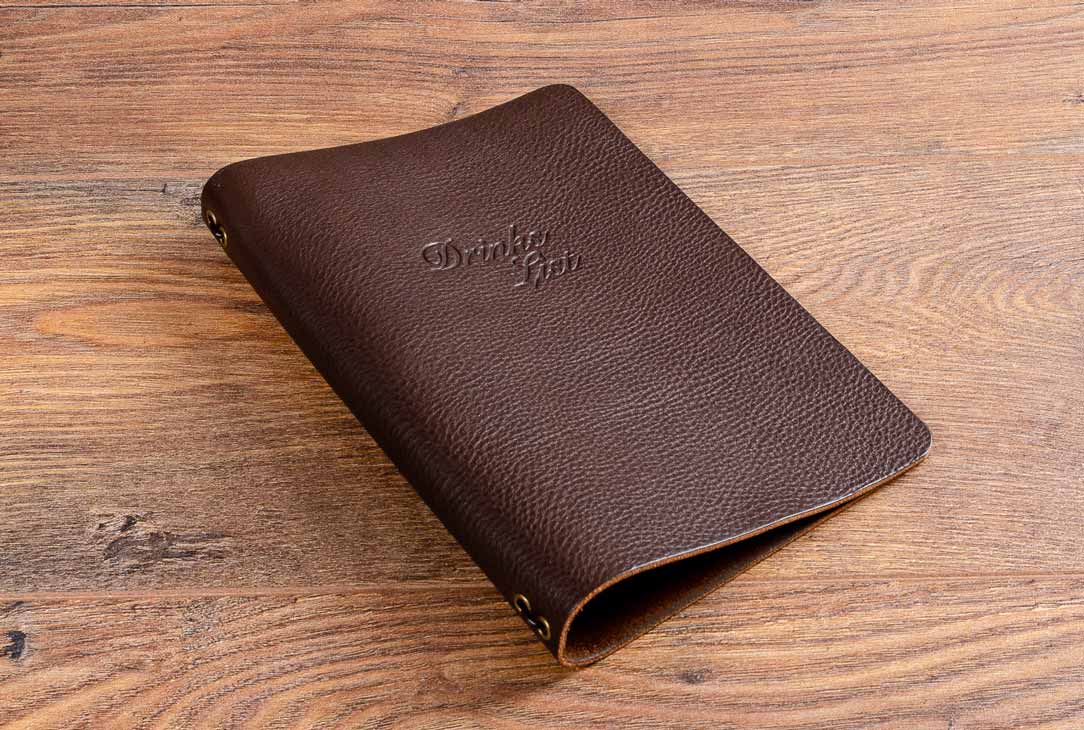A5 sized personalised leather menu cover with elasticated cord page holder