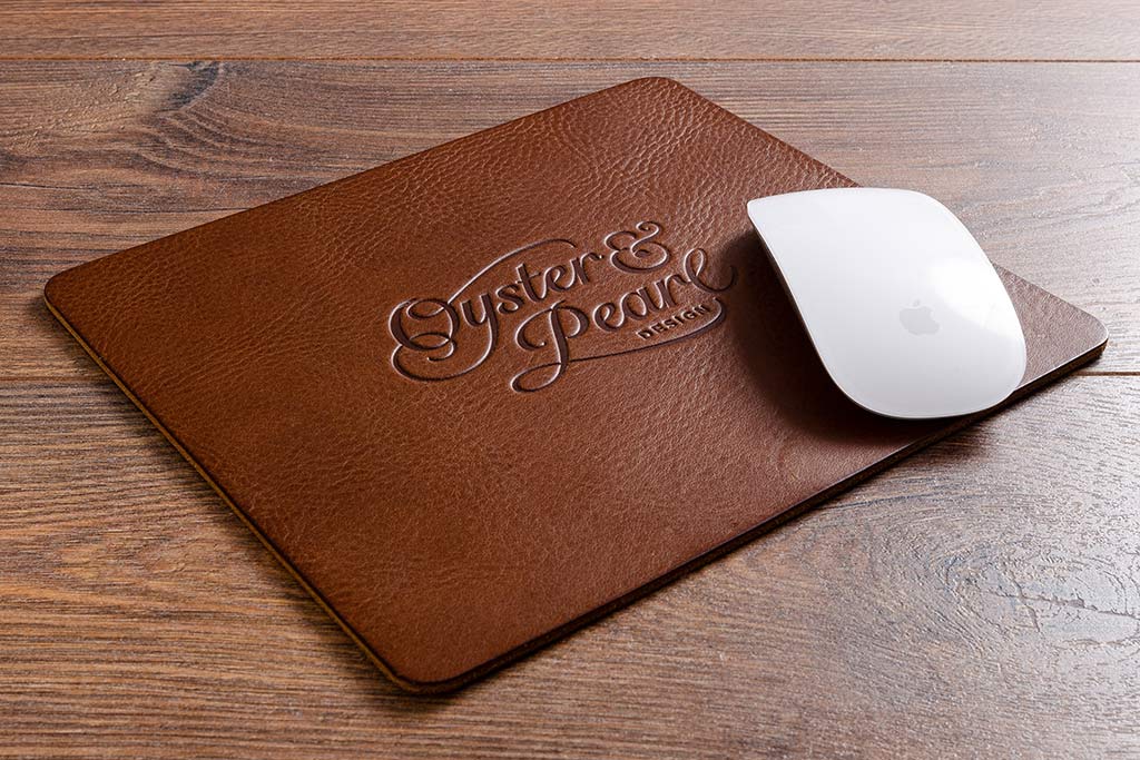 Personalised leather computer mouse mat with blind debossed logo