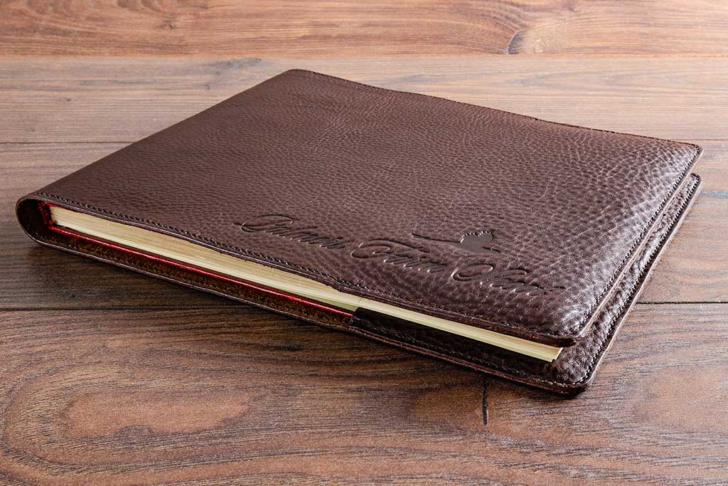 Personalised logos or name can be placed on the bottom right or middle of the leather book jacket