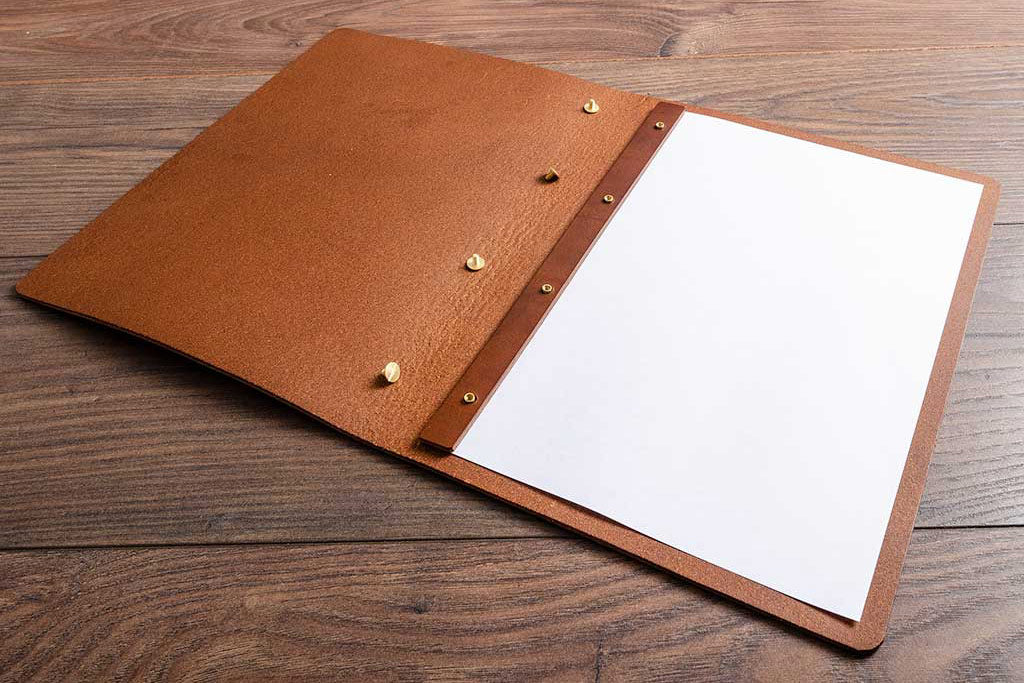 leather menu cover with top of screws taken off