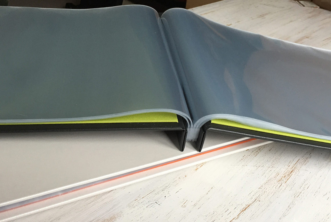 A3 portfolio book with page protectors open and flat