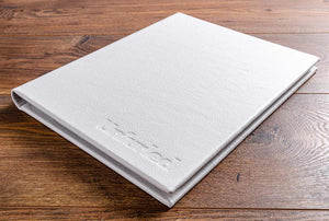 A4 leather bound menu cover in white leather with blind embossed cover