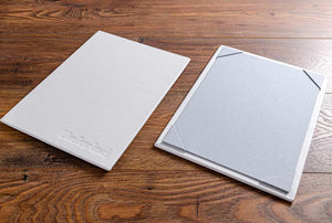 A4 single page menu board bound in genuine white leather and personalised with blind embossed logo 